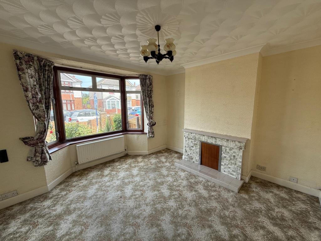 Lot: 149 - SEMI-DETACHED HOUSE FOR IMPROVEMENT IN POPULAR RESIDENTIAL AREA - living room with bay window and fireplace